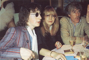 At a birthday party for Julian, Cynthia is seated with her former husband, John Twist